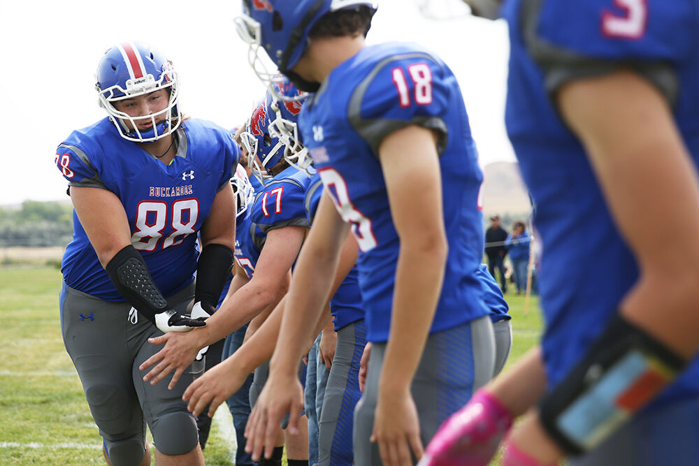 Coy Burnell high fives his teammates